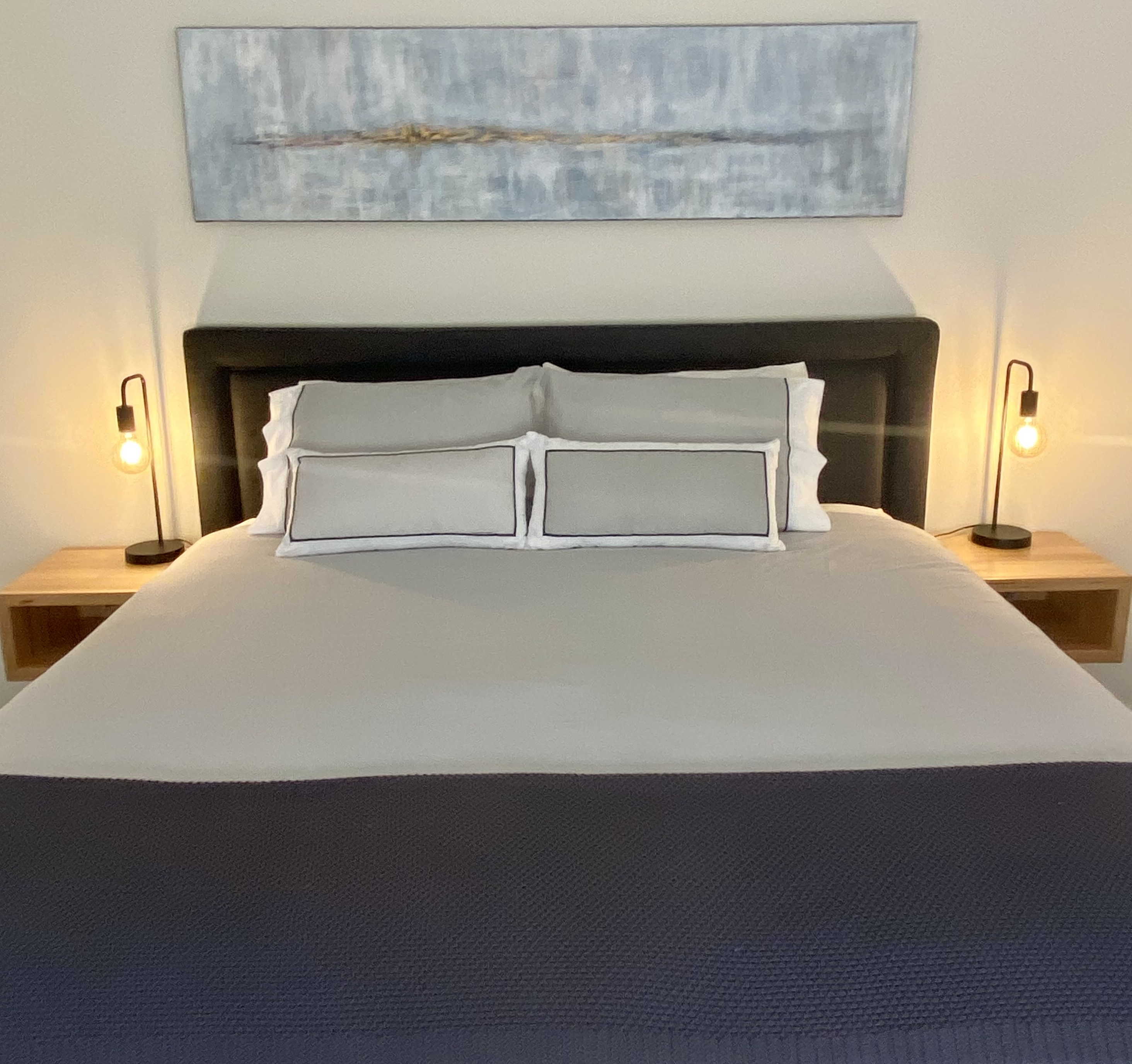 Spacious king bed with luxurious mattress topper and a pillow menu